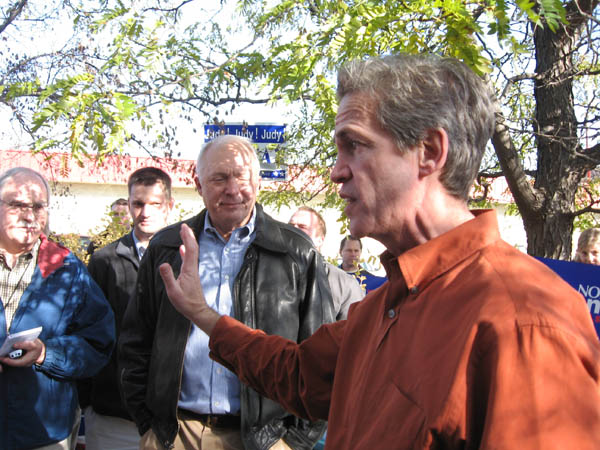 Sen. Norm Coleman, Republican candidate for U.S. Senate, speaks to reporters and supporters during a news conference today in Rosemount. Behind him is 2nd District Rep. John Kline.