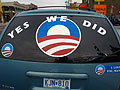 A car displays the phrase 'Yes We Did'