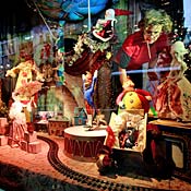 Worker touches up Lord & Taylor Christmas window 