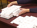 Ballots being re-counted by hand