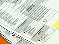 A stack of challenged ballots