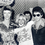 Three rock legends arm in arm 