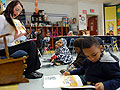 Kindergartners reading with their teacher