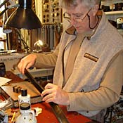 Jeff Taylor works on Sean Cole's belt 