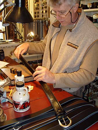 
                Jeff Taylor, owner and proprietor of Cellar Leather in Hyannis, Mass., works on reporter Sean Cole's belt.
                                    (Sean Cole / Marketplace)
                                