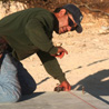 Ramiro Mora snaps a chalk line.