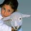 A girl receives a gift from Heifer.org