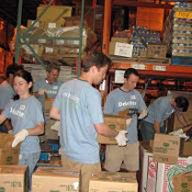 Volunteers stock food at Philabundance 