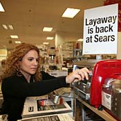 Natalie Lafuentes shops for a toaster at a Sears 
