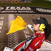 NASCAR official waves the caution flag 