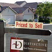 A sign hangs outside a home for sale in Las Vegas. 