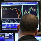 Trader works on fthe floor of the NYSE 