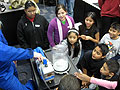 Students watch a science experiment