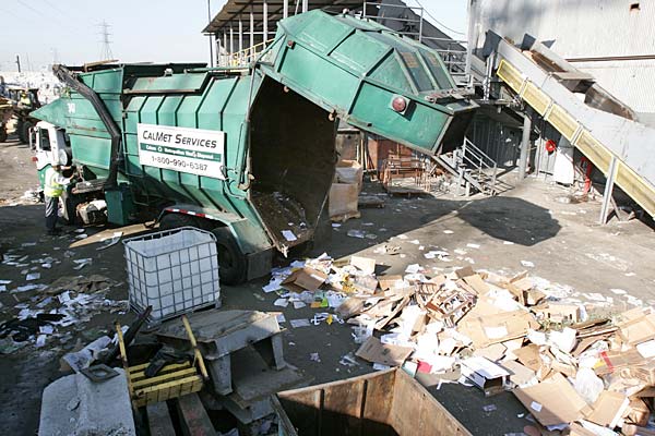 
                A truck delivers a load of used cardboard and paper to Corridor Recycling in Long Beach, Calif.
                                    (Sam Eaton / Marketplace)
                                