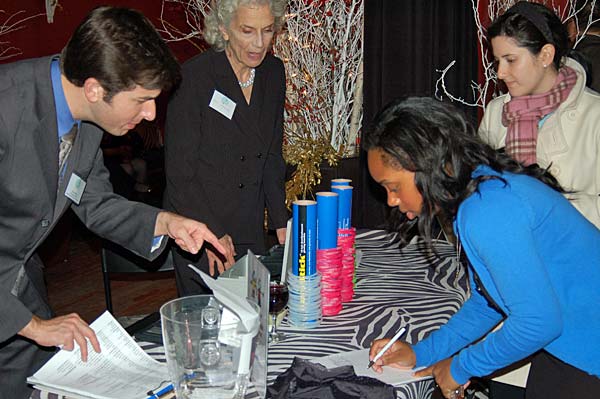 
                A job seeker registers at the Wall Street Pink Slip Party.
                                    (Julia Kaufmann-Yu)
                                