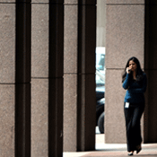 A woman walks past Goldman Sachs headquarters 