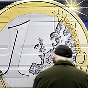 A man looks at logo of Slovak edition of euro 