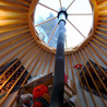 The stove and skylight of the yurt.