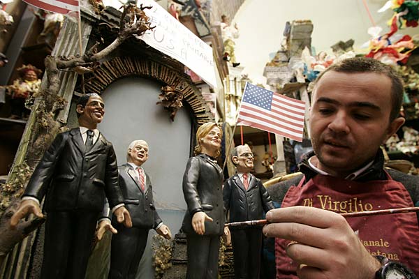 
                Italian craftsman Gennaro Di Virgilio puts finishing touches on his figurines of politicians, from left, Barack Obama, John McCain, Hillary Clinton and Rudolph Giuliani.
                                    (Salvatore Laporta/Getty Images)
                                