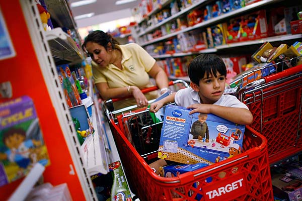 
                Jenny Sotomayor pushes her son Zachary Sotomayor in a shopping cart at a Target store in Miami, Fla.
                                    (Joe Raedle/Getty Images)
                                