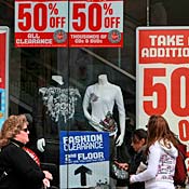 Pedestrians walk by Virgin store in San Francisco 
