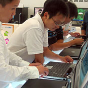 Perusing a laptop in Zhejiang province, China 