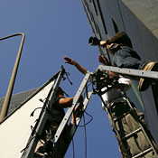 Crew members set up a camera for the shoot in LA 