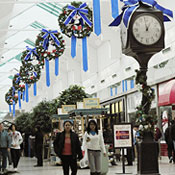 Shoppers walk through the mall in Manassas, Va 