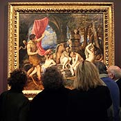 A group of artists look at a Titian painting 