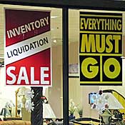 Furniture store advertising liquidation sale. 