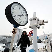 A woman passes in front of a manometer in Ukraine 