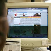 A South African man uses a computer 