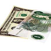 One U.S. dollar and one U.K. pound bank note 