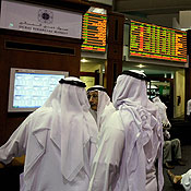 Emirati investors follow the stock market in Dubai 