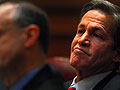 Norm Coleman listens to opening statements