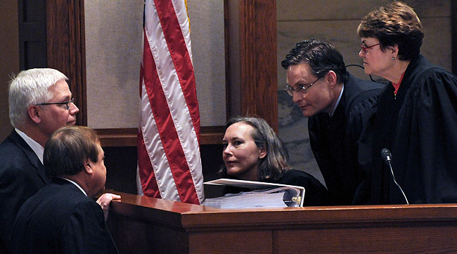 Attorney David Lillehaug and Joe Friedberg talk with the panel of judges, (from left to right) Denise Reilly, Kurt Marben and Elizabeth Hayden during the afternoon session.