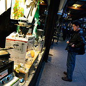A man looks into a shop window in New York 