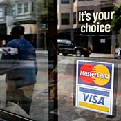 Window sticker advertising Visa, Mastercard 