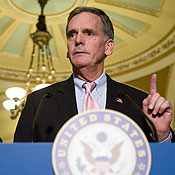 Sen. Judd Gregg speaks at a press conference 