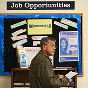 Job seeker checks listings in Oakland, Calif. 