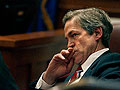 Norm Coleman listens in court