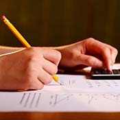 Person with pencil and calculator 