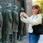 Tourist photographs a Great Depression memorial 