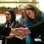 Job seeker, employer shake hands at job fair