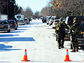 Officers surround a mobile home