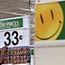 Wal-Mart employee Michelle Triplett stocks food