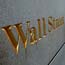 A trader heads into the New York Stock Exchange