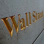 A trader heads into the New York Stock Exchange 