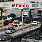 Cars drive across Mexico/U.S. border 