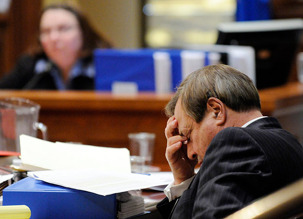 Norm Coleman attorney Joe Friedberg rests his eyes as Pamela Howell, background, is cross examined by Al Franken attorneys during the Senate vote recount trial Monday, March 2, 2009 in St. Paul, Minn.